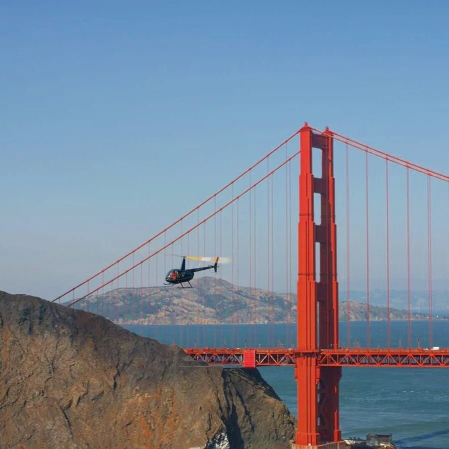 Robinson R-66 turbine helicopter over San Francisco