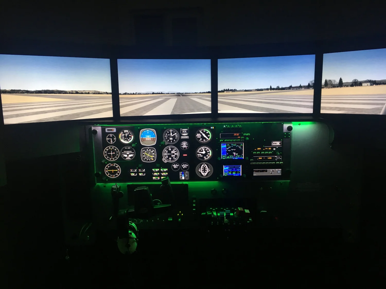 RedBird LD simulator multi-panel view of a runway on final